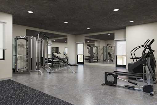 A spacious gym with a variety of equipment.