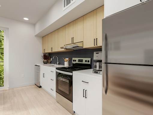A modern kitchen with stainless steel appliances and wooden cabinets.