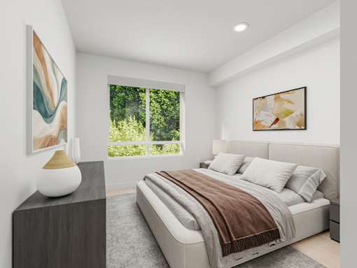 A bedroom with a large bed and a painting on the wall.