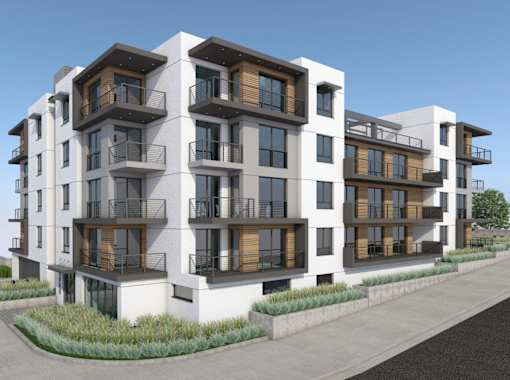 A modern apartment building with balconies and windows.