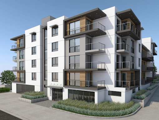 A modern apartment building with balconies and windows.