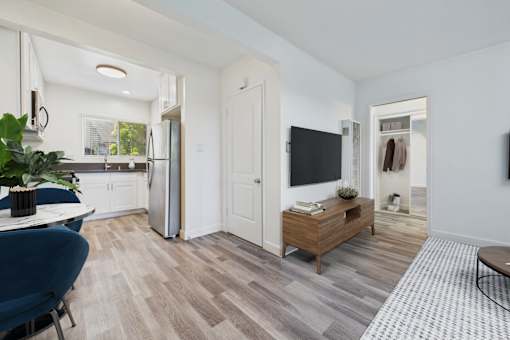 A modern kitchen with a dining table and chairs.