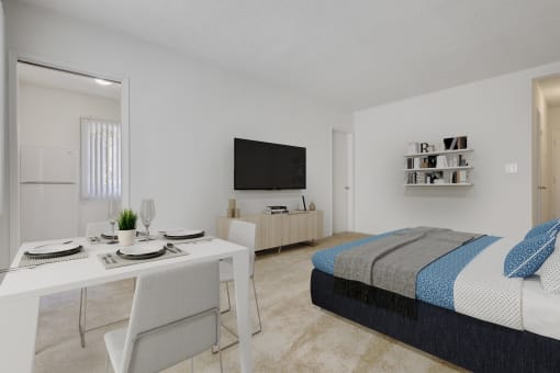 a bedroom with a bed and a desk and a television