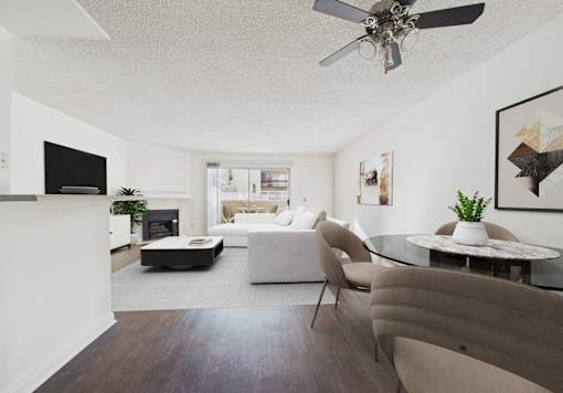 A modern living room with a white sofa and a glass coffee table.