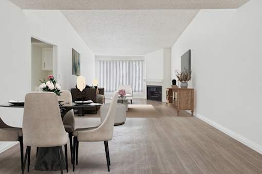 A dining room with a table and chairs.