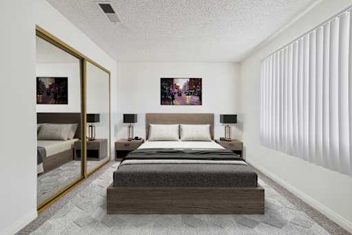 A bedroom with a large bed and a mirror on the wall.