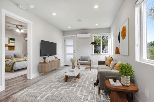 a living room with a couch and a tv