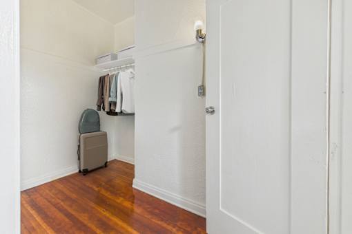 A white door with a silver handle is on the right side of the image.