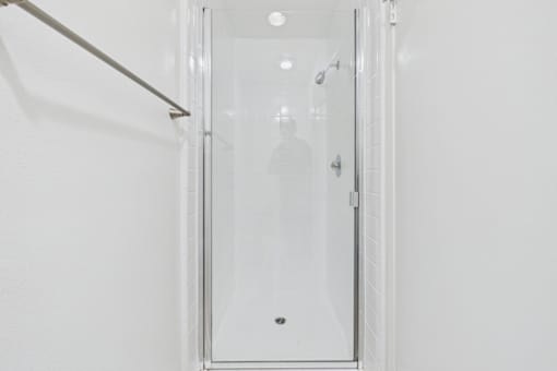 A white door with a glass panel and a silver handle.
