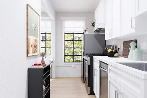 Luxury apartment kitchen with premium stainless steel appliances and modern finishes.