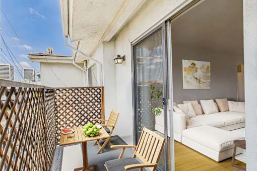 A patio with a table and chairs is shown.