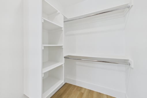 Empty white shelves in a room.