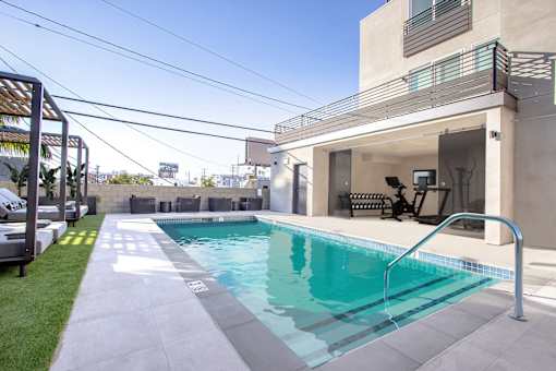 a swimming pool in the backyard of a house