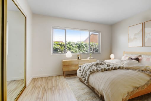 a bedroom with a bed and a window