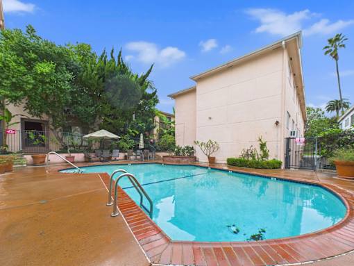 A small pool with a red brick border.