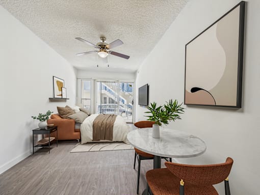 A living room with a brown chair and a white table.