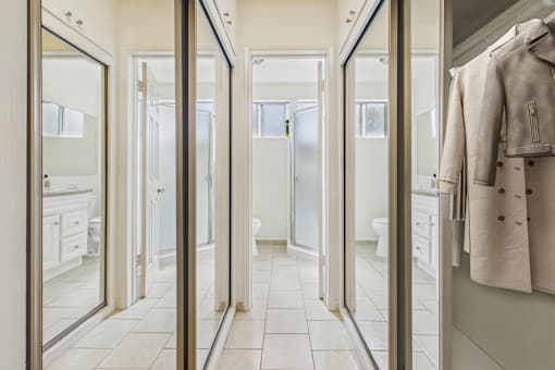 A bathroom with a white towel hanging on the wall.