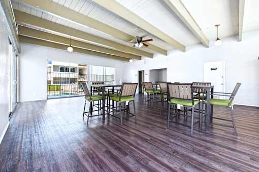 A room with a long table and chairs.