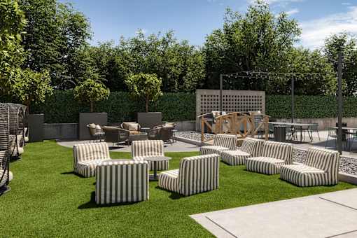 Cozy outdoor space featuring a fire pit and contemporary lounge seating