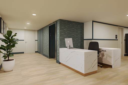 Welcoming residential lobby with a concierge desk, resident mailboxes, and elegant contemporary finishes