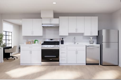 Modern kitchen featuring stainless steel appliances, sleek cabinetry, and ample counter space.