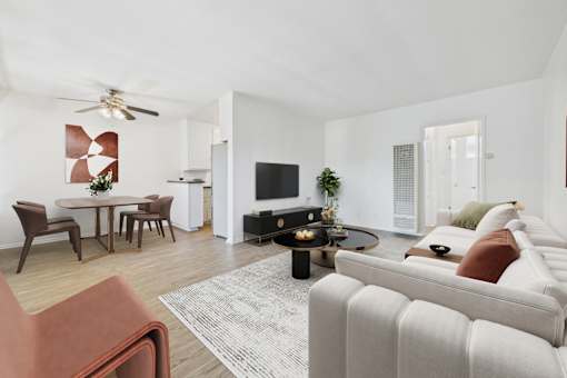 A living room with a white couch and a coffee table.