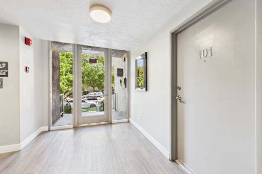 A hallway with a door numbered 101 on the right.