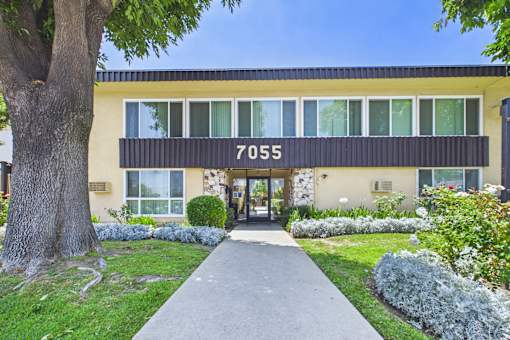 A building with the number 7055 on the front.