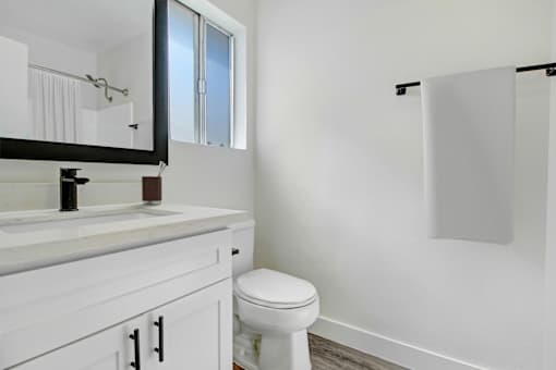 an empty bathroom with a toilet and a sink