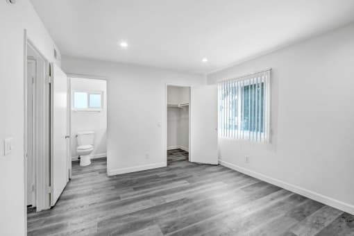 a renovated bathroom with a toilet and a closet