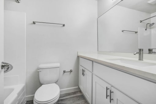 an empty bathroom with a toilet and a sink