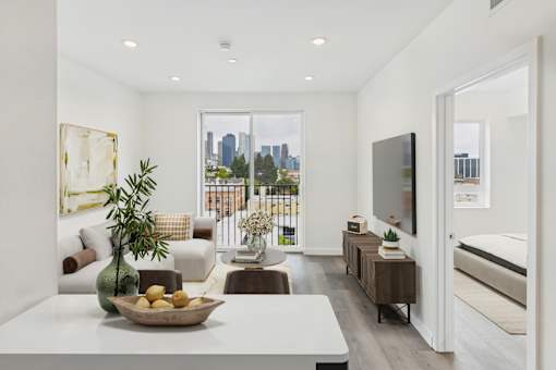 A modern living room with a view of the city.