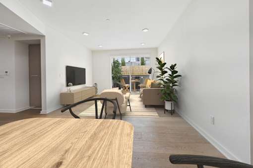 A modern living room with a wooden table and a flat screen TV.