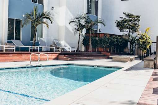Courtyard Resort-style heated pool with lounge chairs