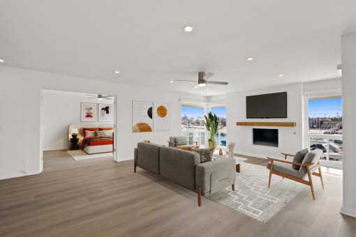 a living room with a couch and a chair and a fireplace