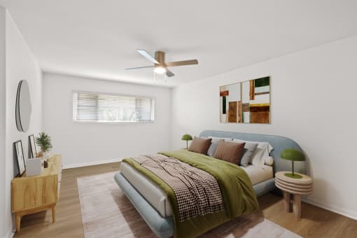 a bedroom with a bed and a ceiling fan