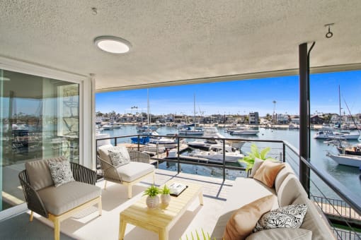 a living room with a view of a marina