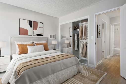 A bedroom with a large bed and a wardrobe.