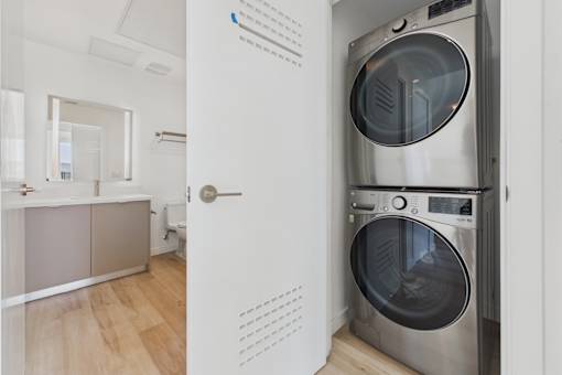 A modern laundry room with a washer and dryer.