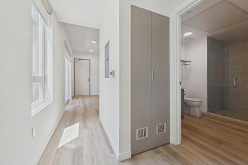 A bathroom with a toilet and a walk-in shower.