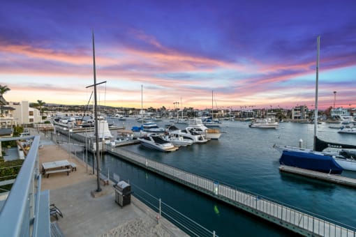 a marina filled with boats at sunset