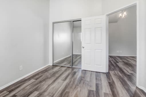 the living room of our studio apartment atrium with a door to the closet