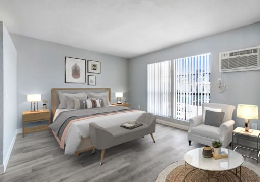 a bedroom with a bed and a chair in a 555 waverly unit