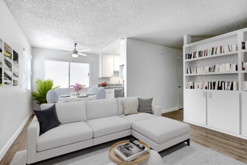 a living room with a white couch and a table