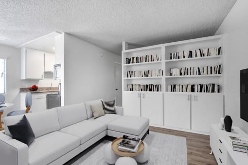 a living room with a white couch and a table
