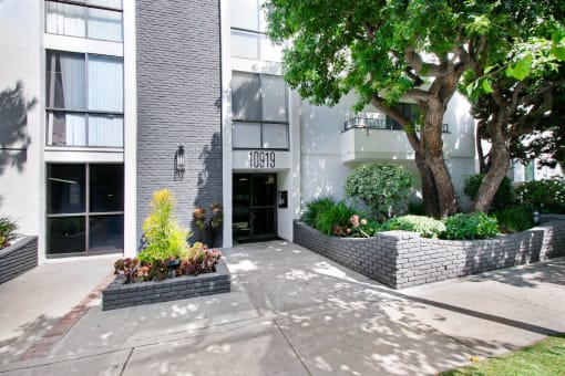a building with a tree in front of it