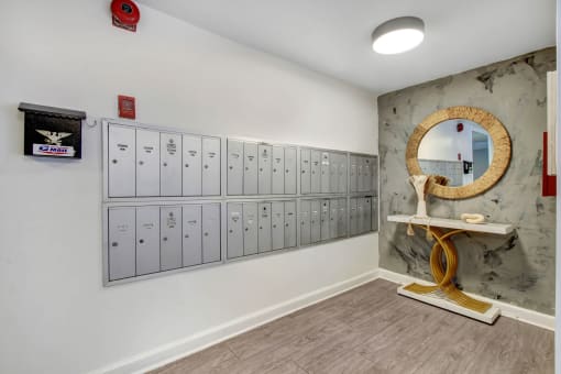 a locker room with lockers and a mirror