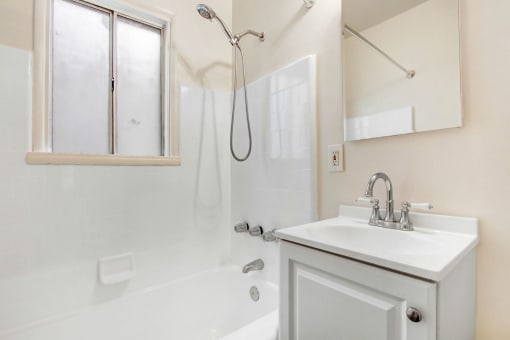a bathroom with a bathtub and a sink