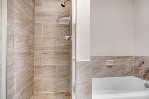 a bathroom with a shower and a sink
