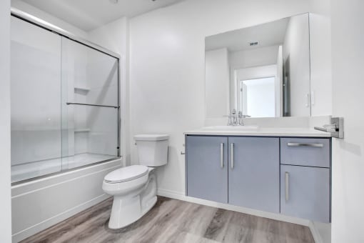 a bathroom with a sink toilet and a shower